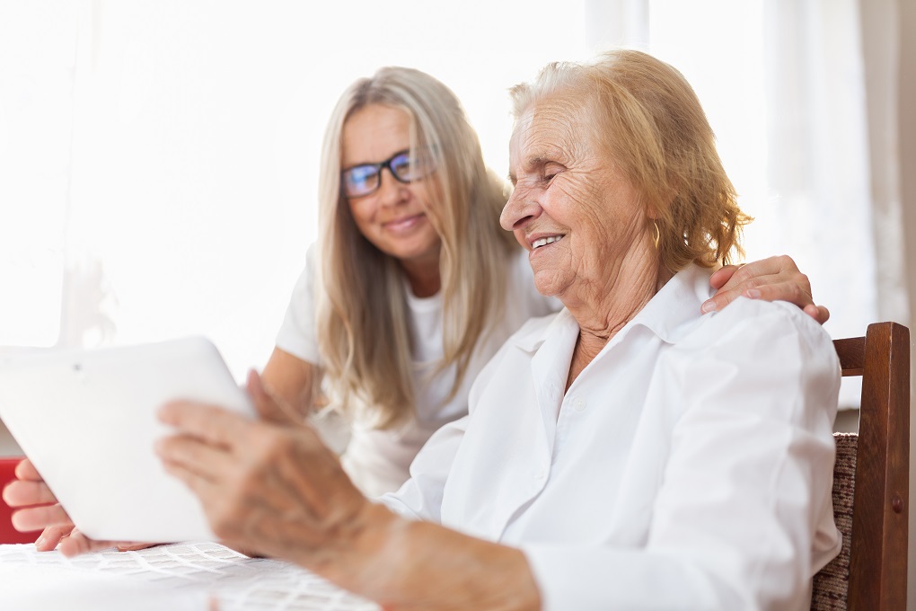 Supporter providing information to senior woman