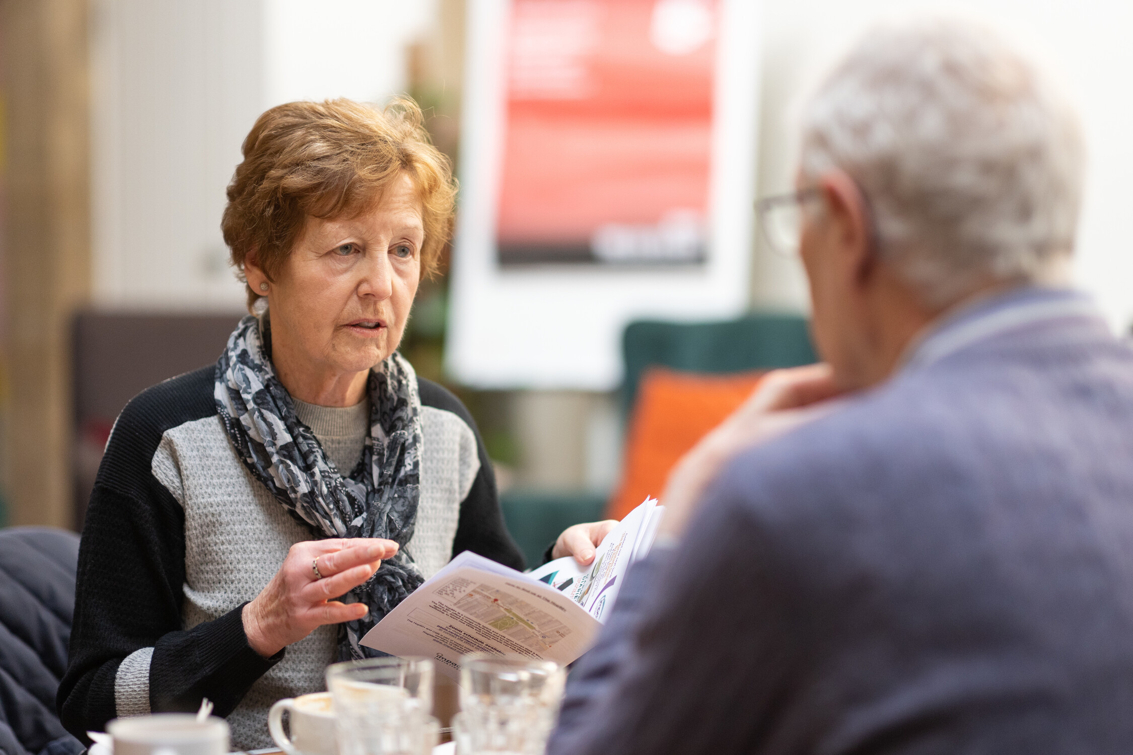 Two older people having a conversation