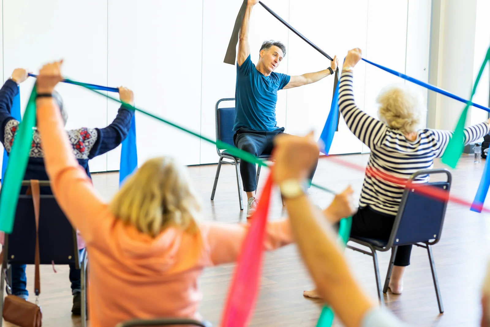 A group of individuals participate in an exercise class